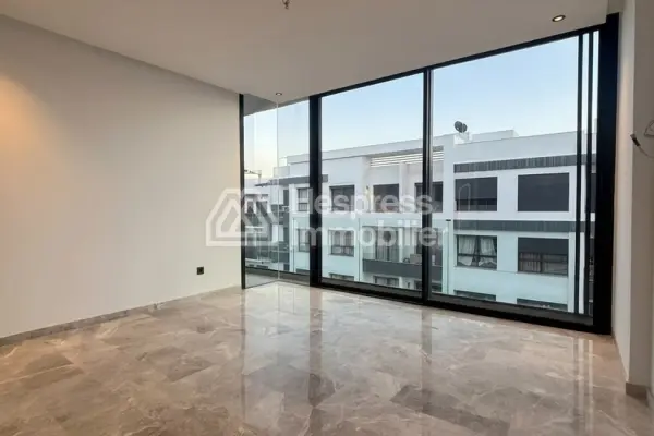Sale of a lovely apartment in Palmier. 1 Living area. Reinforced door, traditional Moroccan living room