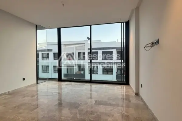 Sale of a lovely apartment in Palmier. 1 Living area. Reinforced door, traditional Moroccan living room