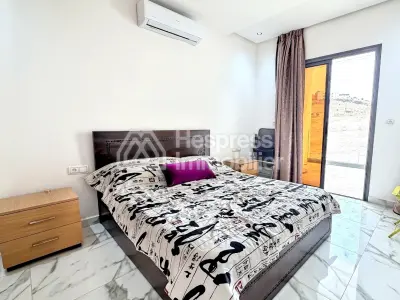 Beachfront apartment in Aourir with swimming pool. Mid-term rental.