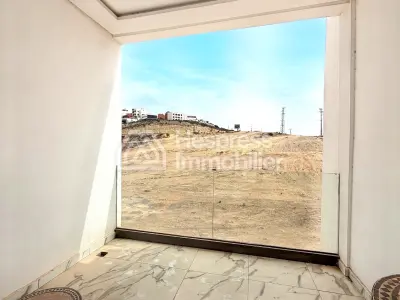 Beachfront apartment in Aourir with swimming pool. Mid-term rental.
