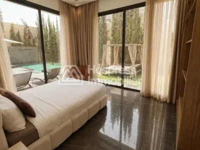 Maison de luxe à vendre sur Ourika Road. 7 chambres confortables et piscine chauffée.
